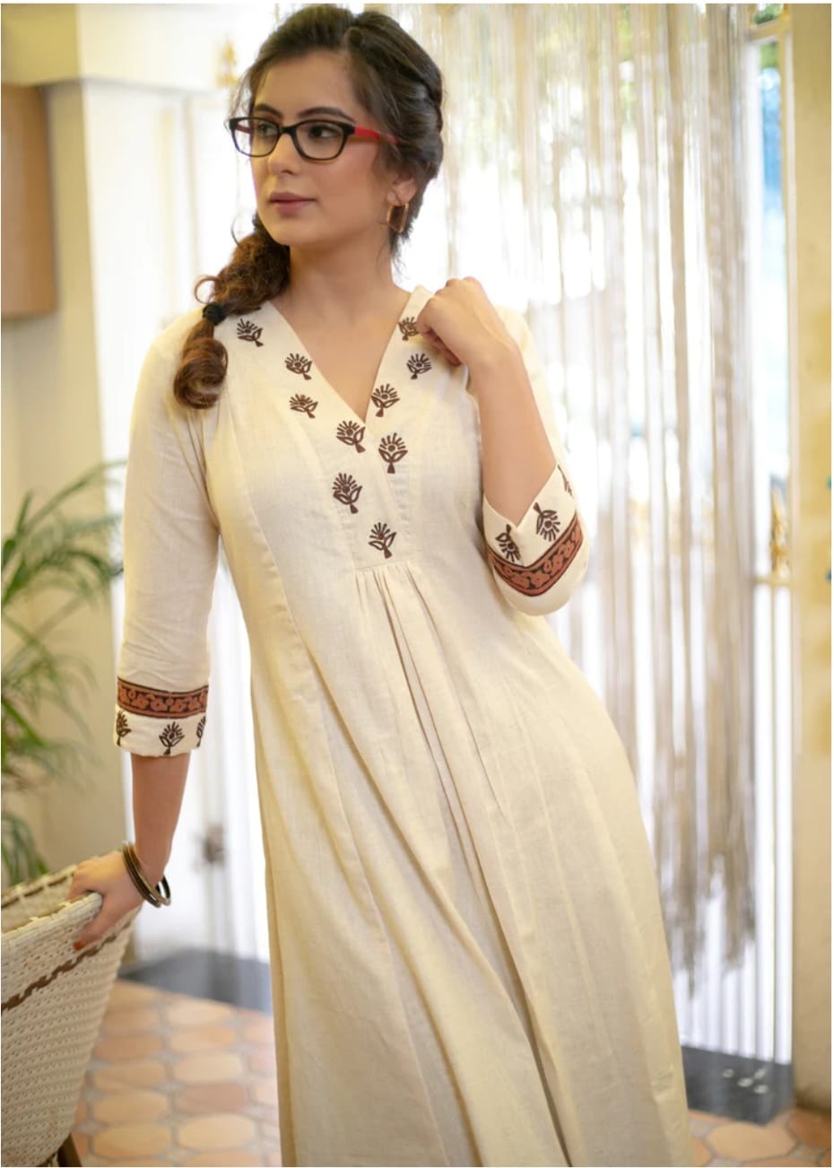 Classy Cotton Flex Off-White Kurta With Embroidered Yoke And Sleeves Paired With Printed Pant