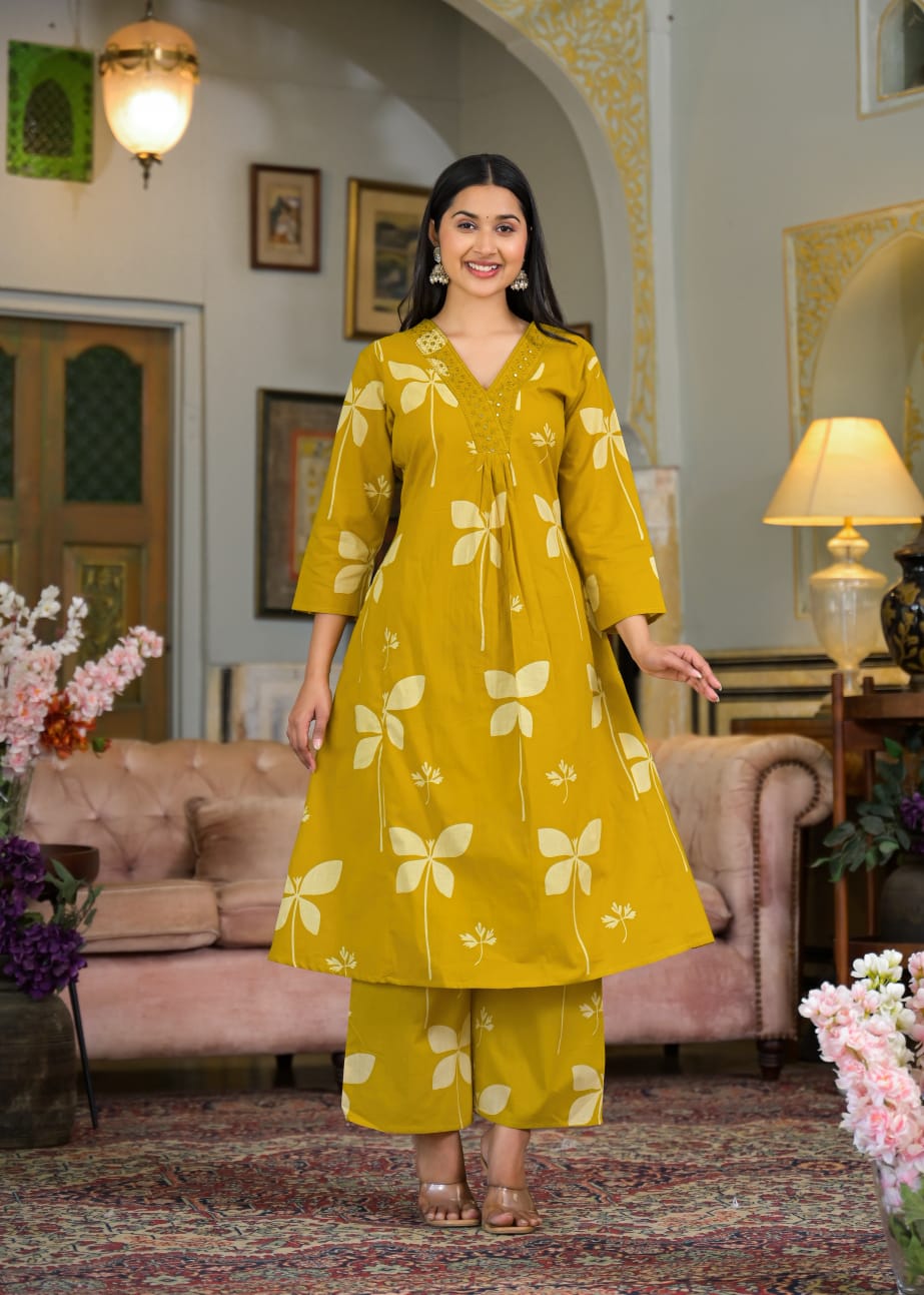 Beautiful Pure Cotton Fabric Printed A Line Kurti With Pocket + Embroidered V-Neck border Paired With Printed Pant
