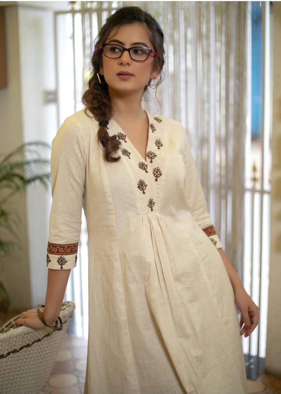 Classy Cotton Flex Off-White Kurta With Embroidered Yoke And Sleeves Paired With Printed Pant