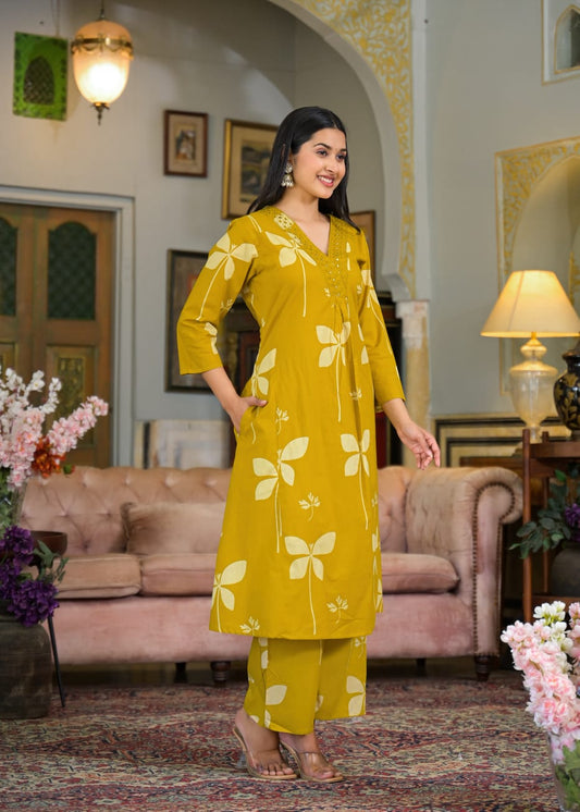 Beautiful Pure Cotton Fabric Printed A Line Kurti With Pocket + Embroidered V-Neck border Paired With Printed Pant