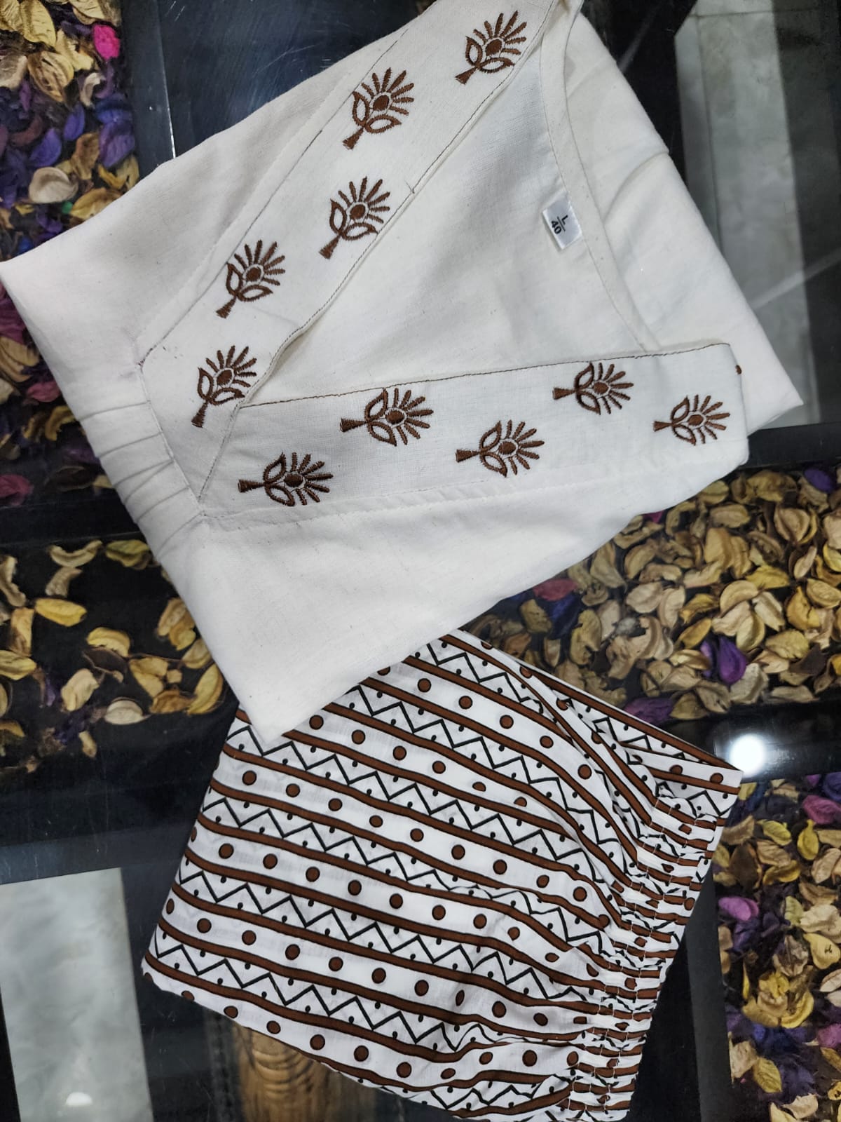 Classy Cotton Flex Off-White Kurta With Embroidered Yoke And Sleeves Paired With Printed Pant