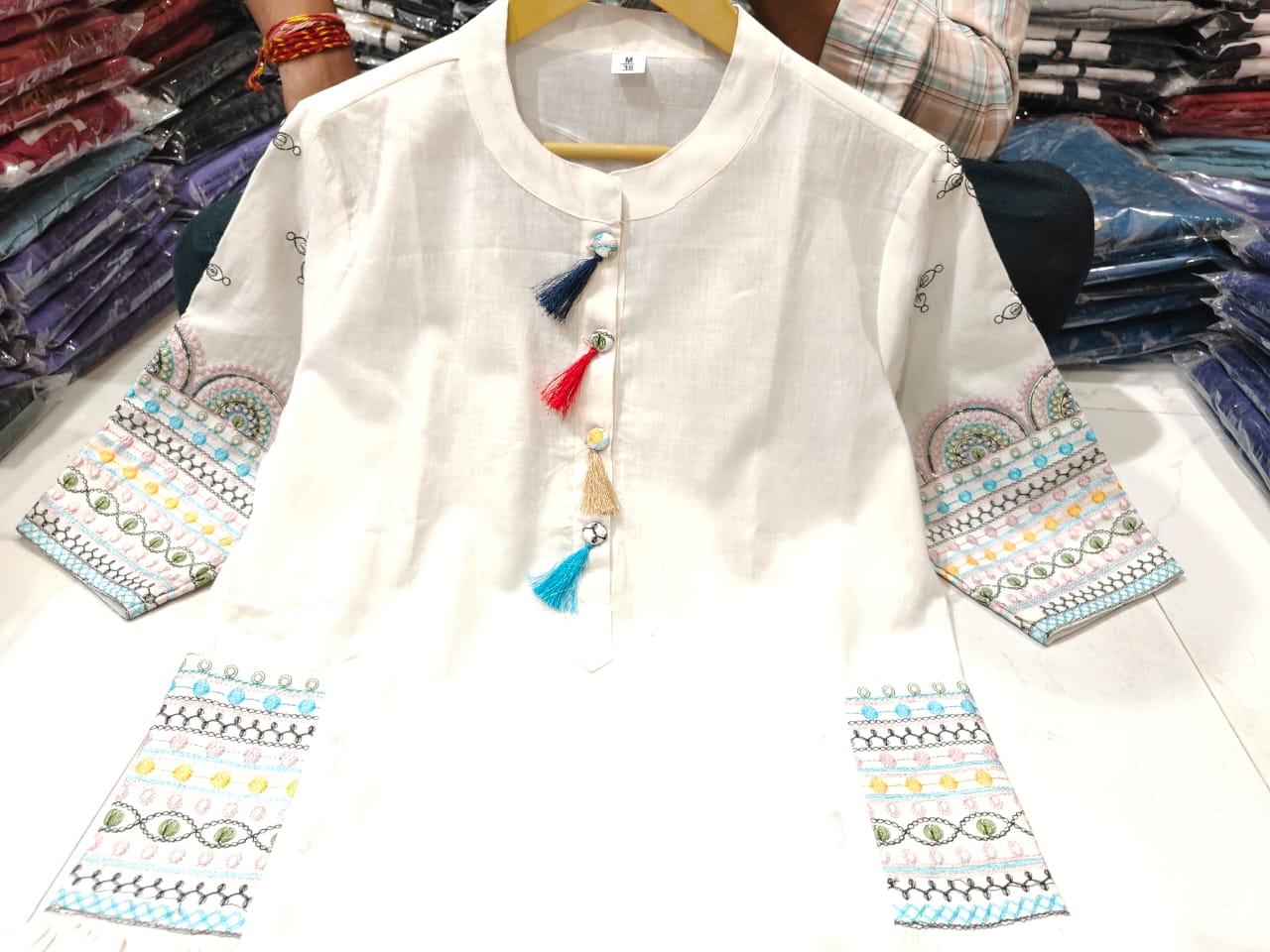 White aline kurta Style made from high-quality cotton, embellished with sequance embroidery work on hand sleeves and side line and paired with matching pant