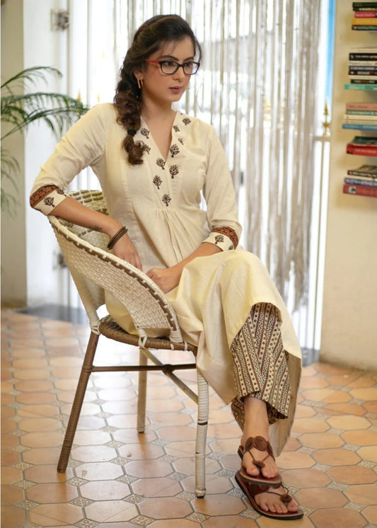 Classy Cotton Flex Off-White Kurta With Embroidered Yoke And Sleeves Paired With Printed Pant
