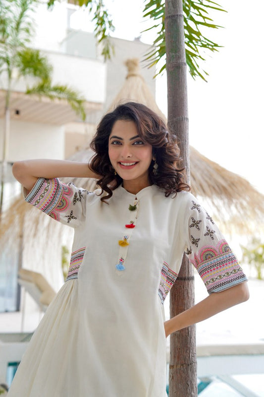 White aline kurta Style made from high-quality cotton, embellished with sequance embroidery  work on hand sleeves and side line and paired with matching pant